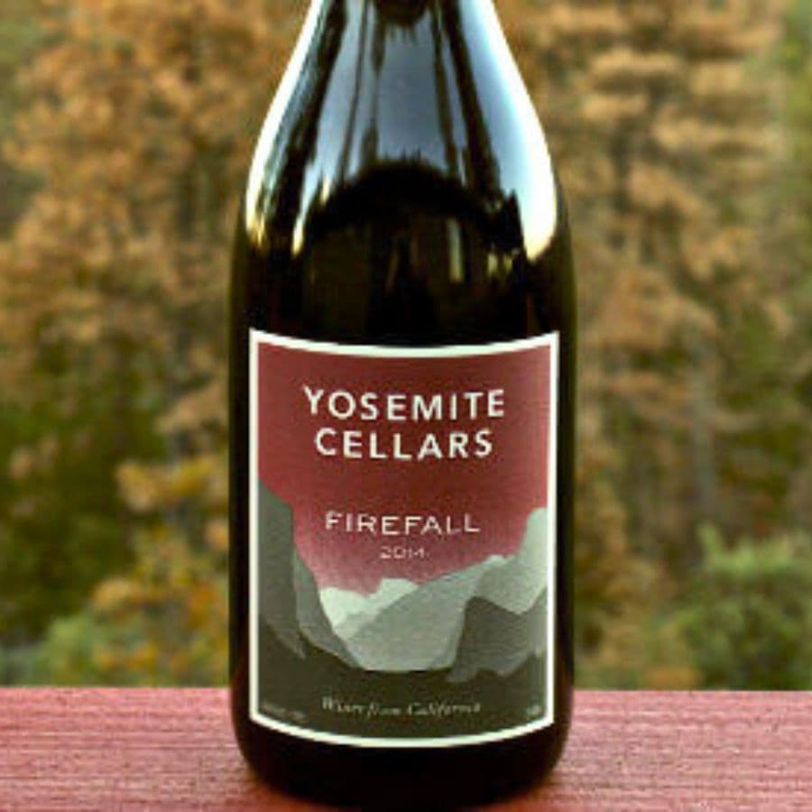 A bottle of Yosemite Cellars Firefall wine from 2014 against a blurred natural background.
